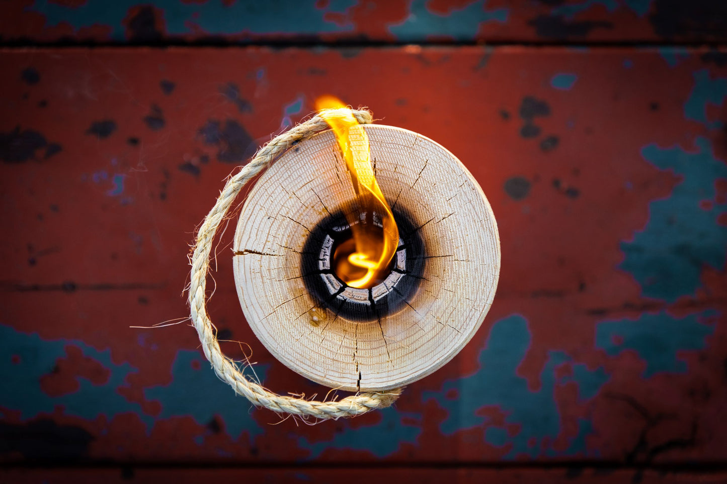 Swedish fire log burning with flames emerging from center cut