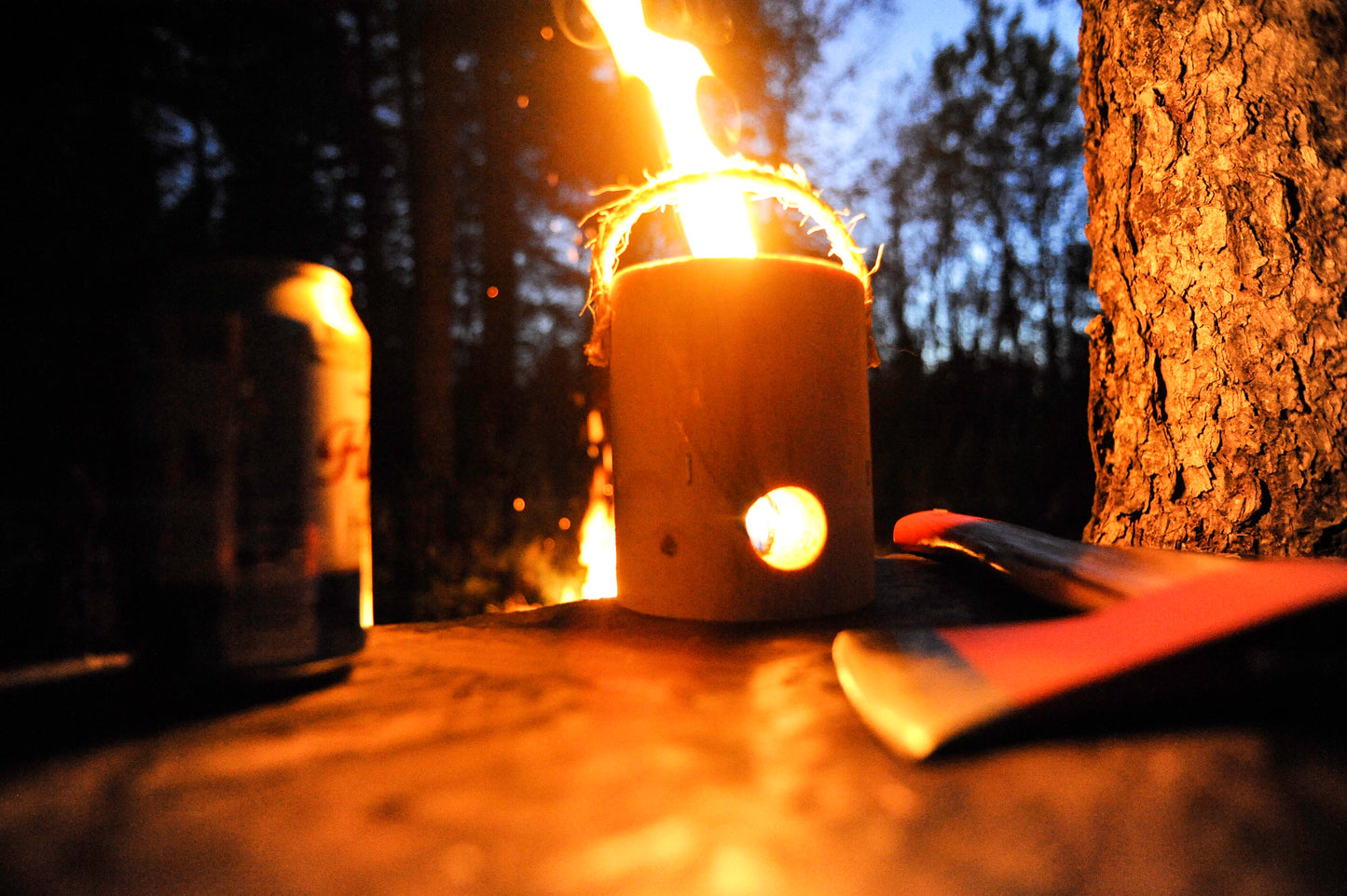 Small Swedish torch burning on outdoor table