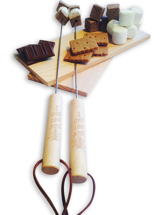 Two wooden marshmallow roasting sticks with pointed ends